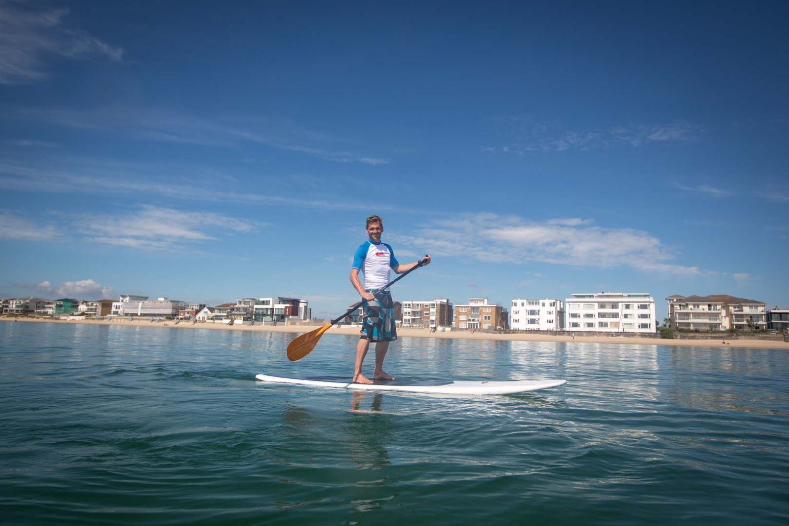 Paddleboarder enjoying the calm waters of Poole harbour 